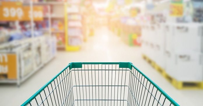Supermarket store abstract blur background with shopping cart, Supermarket aisle with empty shopping cart